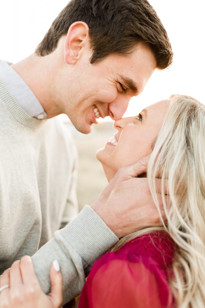 couple smiling joyfully while looking in to each others eyes