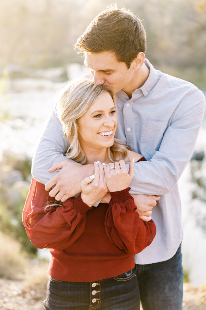 couple hugging and laughing at Lost Lake for fall engagement photos