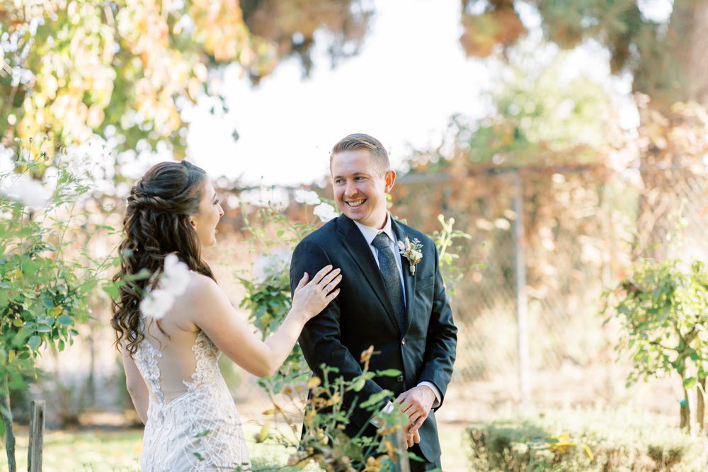 Bride and Grooms first look outside at Kings River Winery wedding