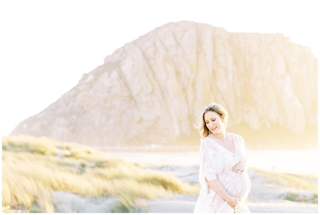 Pregnant woman at sunset during beach maternity photos