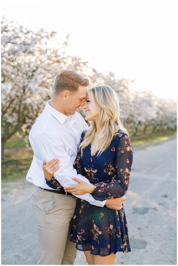 Man embracing fiance for spring engagement photos