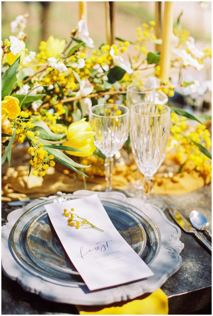 mustard wedding flowers with crystal and silver luxury table decor