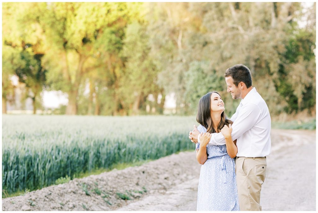 Couple laughing with each other during spring engagement photos
