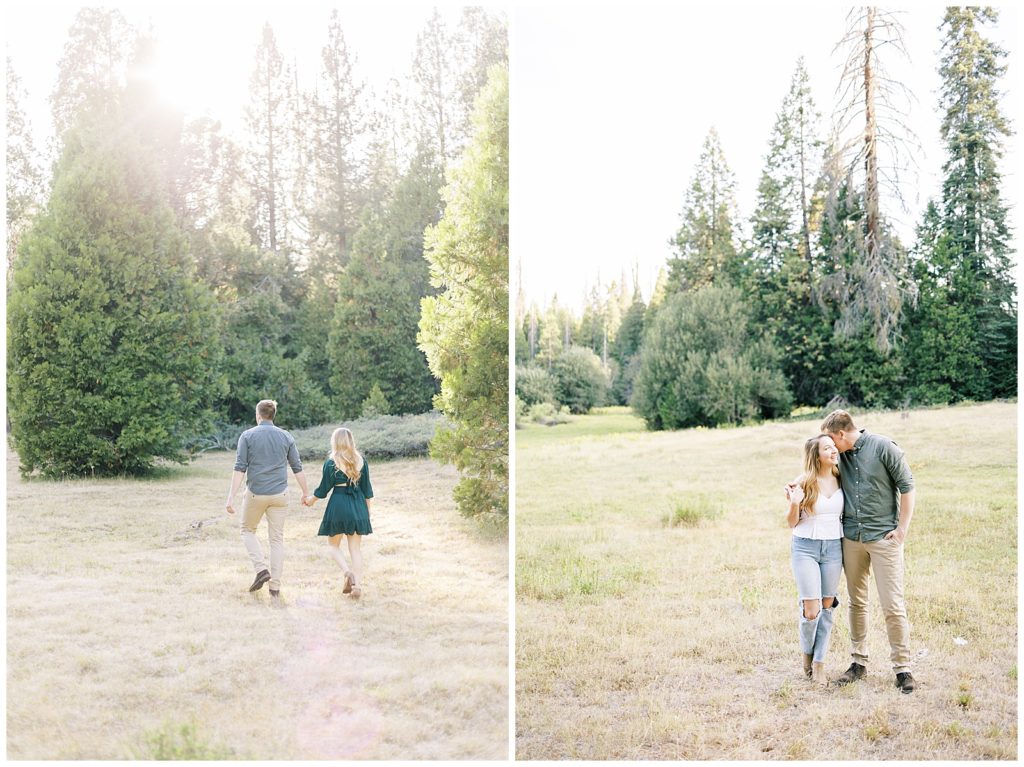 engaged couple holding hands walking through meadow