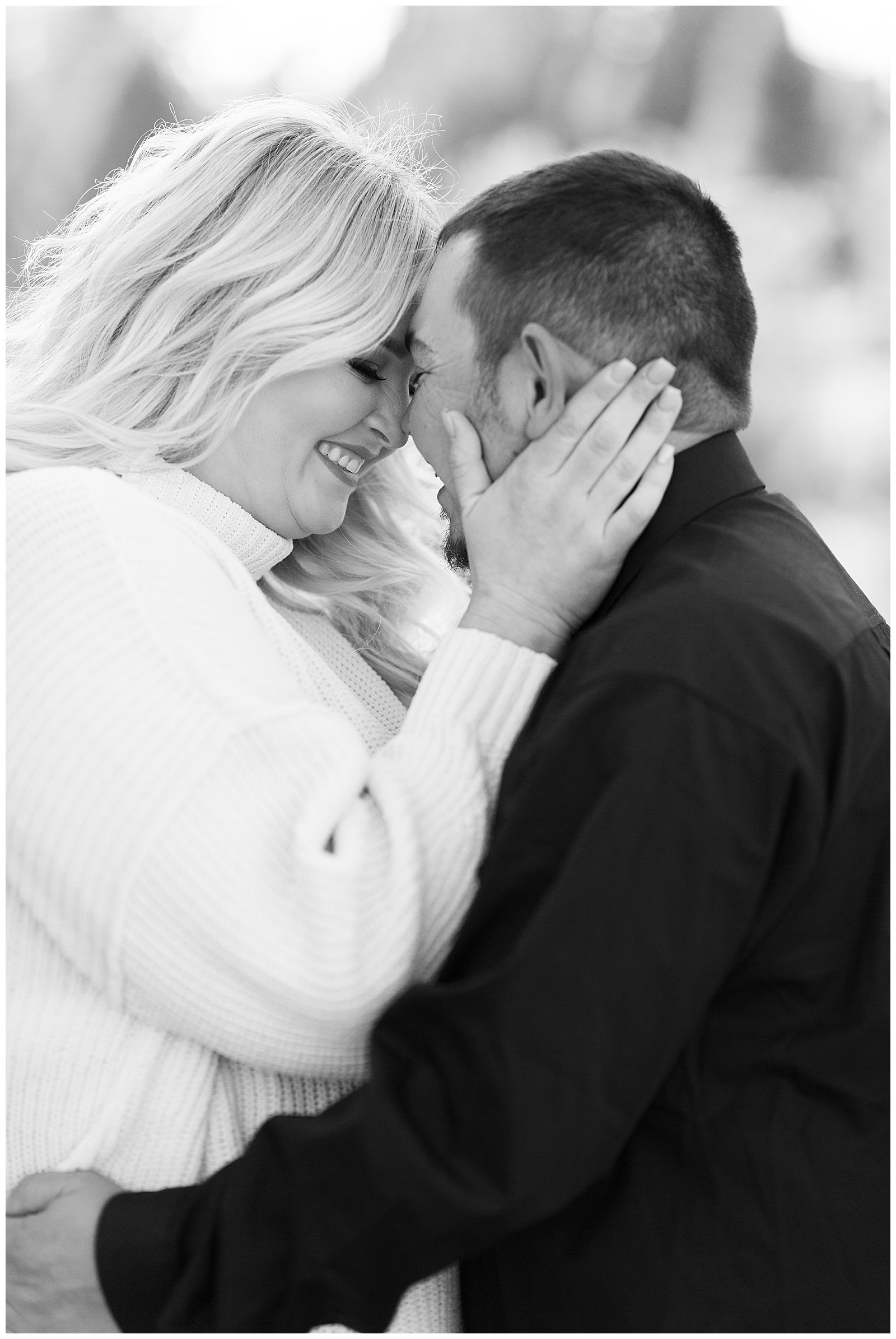 black and white photo woman smiling and embracing man
