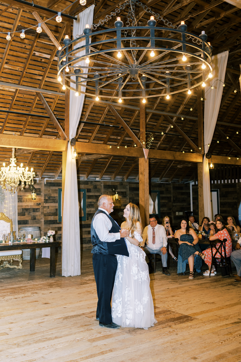 bride dancing with her father at barn wedding reception