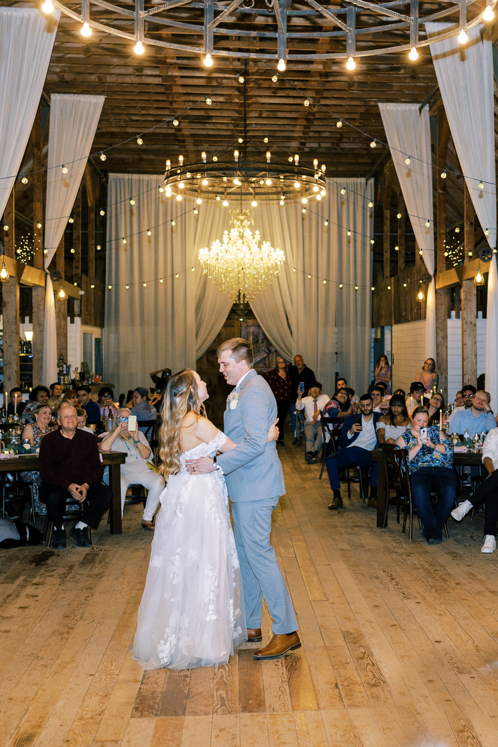bride and groom first dance in barn at springville ranch