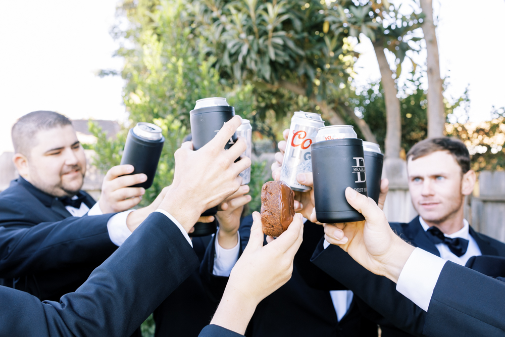 close up of groomsmen toasting with coors light