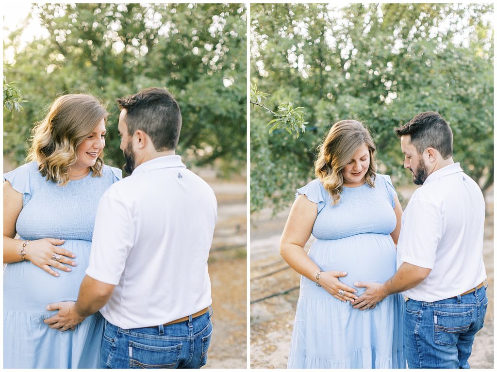 pregnant couple embracing and holding baby belly