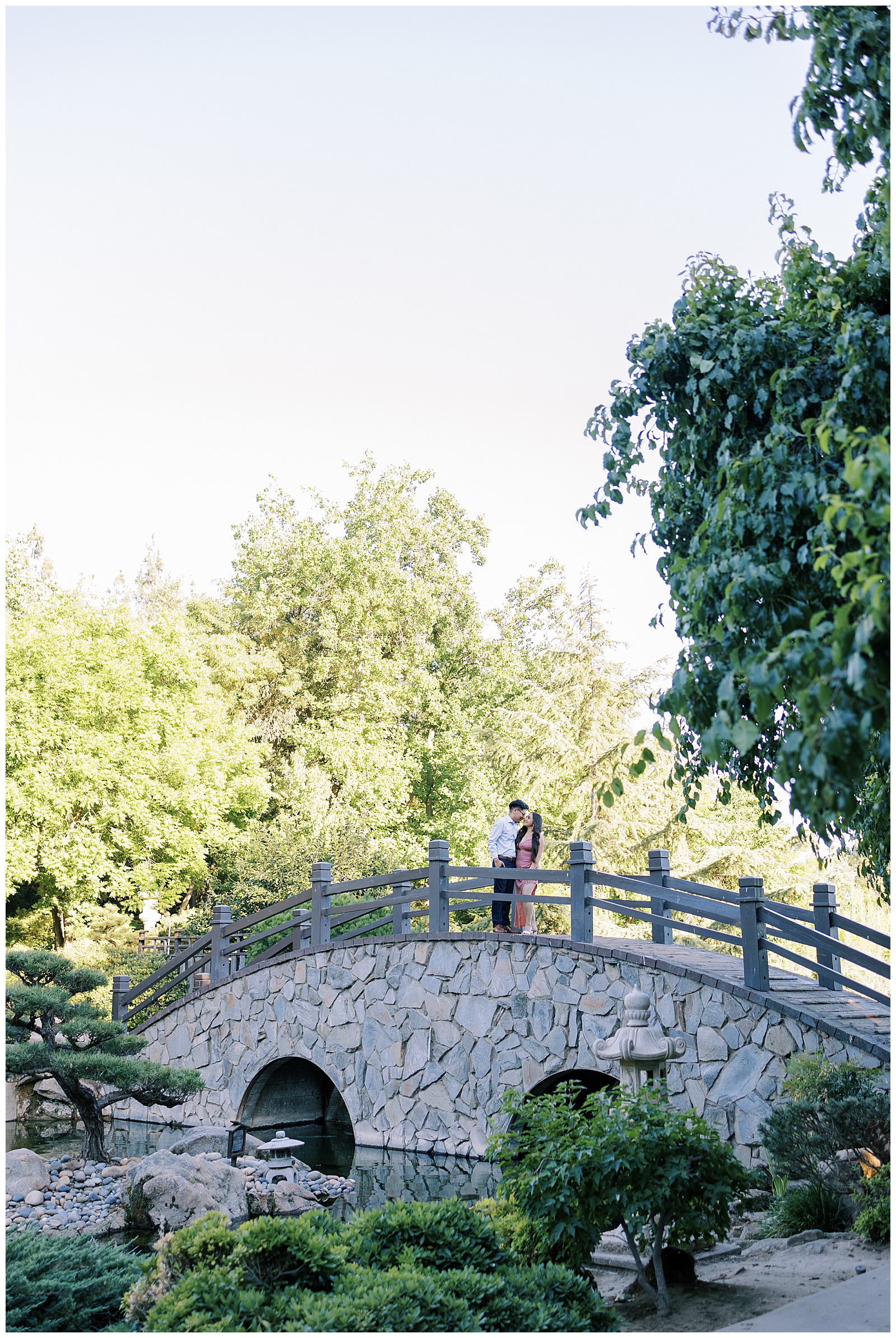 engaged couple on bridge shinzen japanese gardens