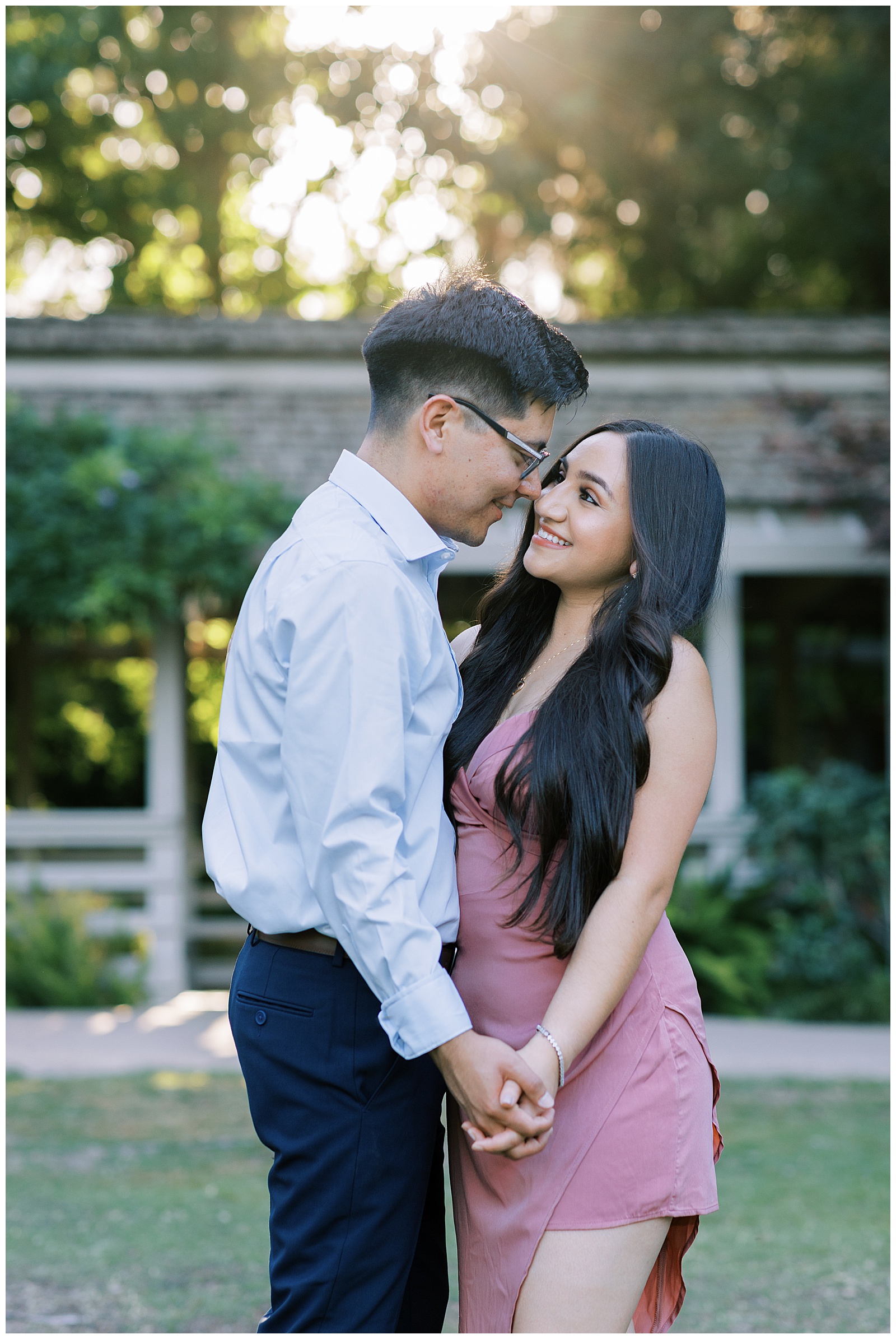 engaged couple looking at each other dancing in sunset at shinzen japanese gardens fresno california fresno wedding photographer