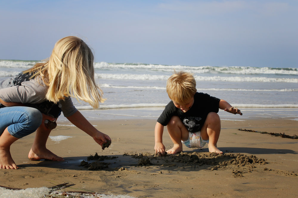 kids playing in the sand at pismo beach
