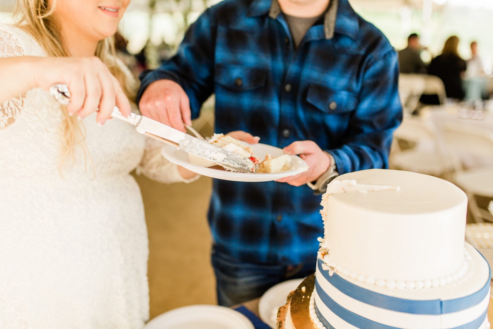 bride and groom cutting the cake at a casual wedding reception in fresno california