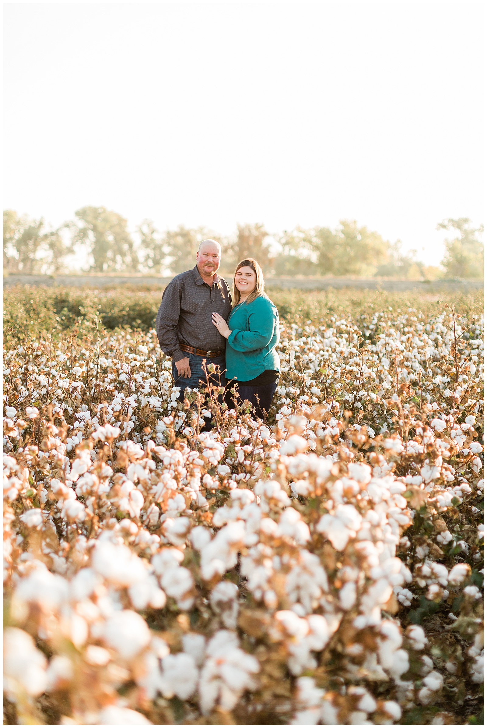 couple posing in a cotton field