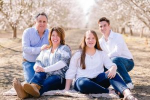 family photos in an almond orchard during blossom season