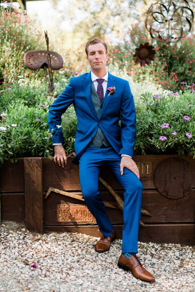navy and pink groom outfit