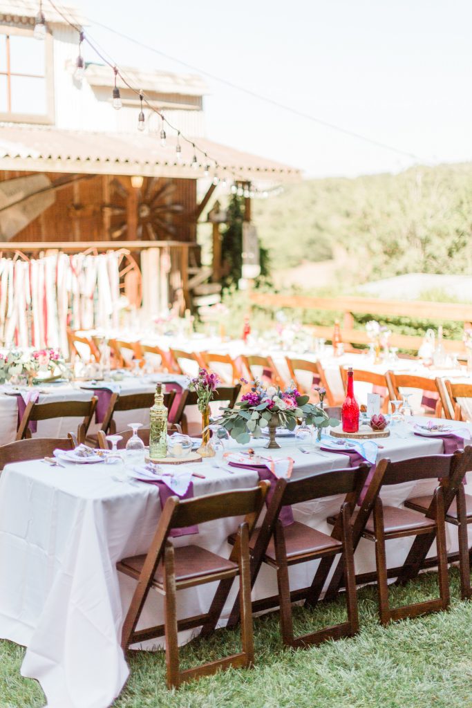 purple table decor and brown chairs