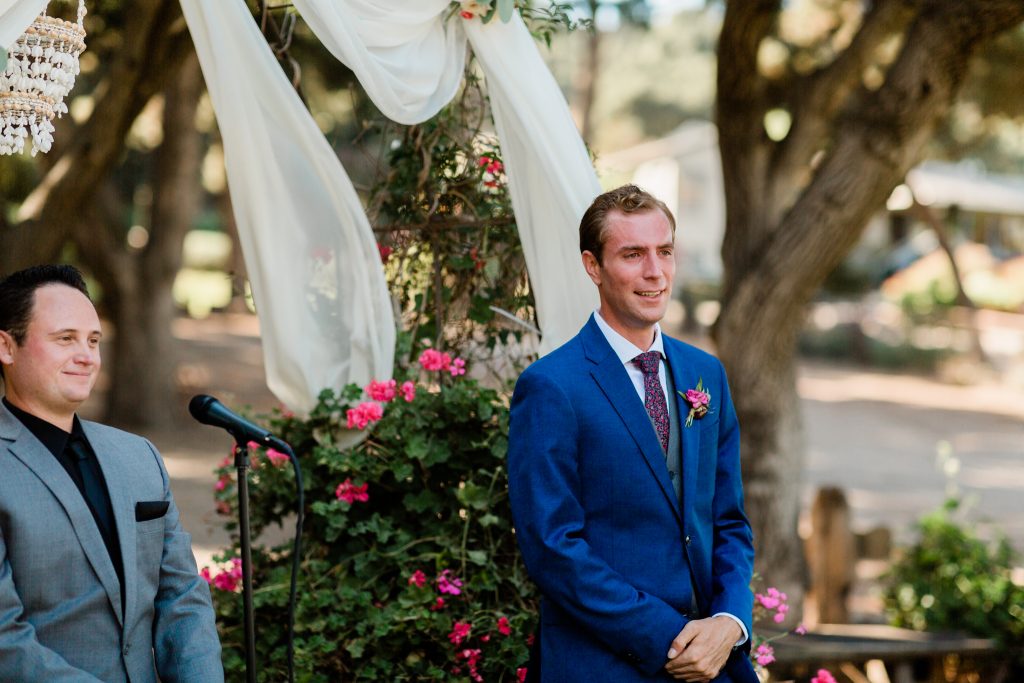 grooms first look at bride down the aisle 