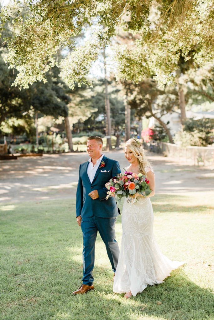 detailed wedding dress and colorful florals