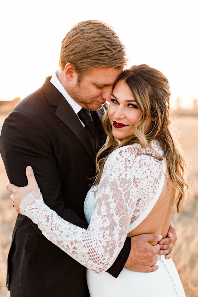 Bride and groom sunset portraits at a winter wedding at R&C ranch in Fresno California.