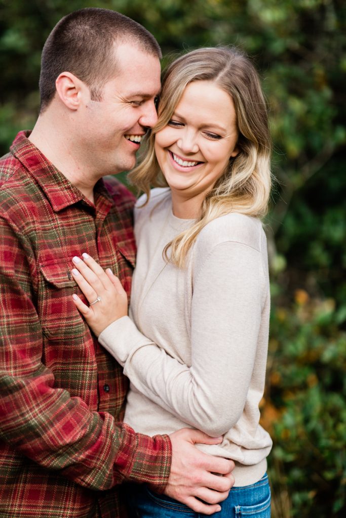fall engagement photos with red flannel shirts and cozy sweaters