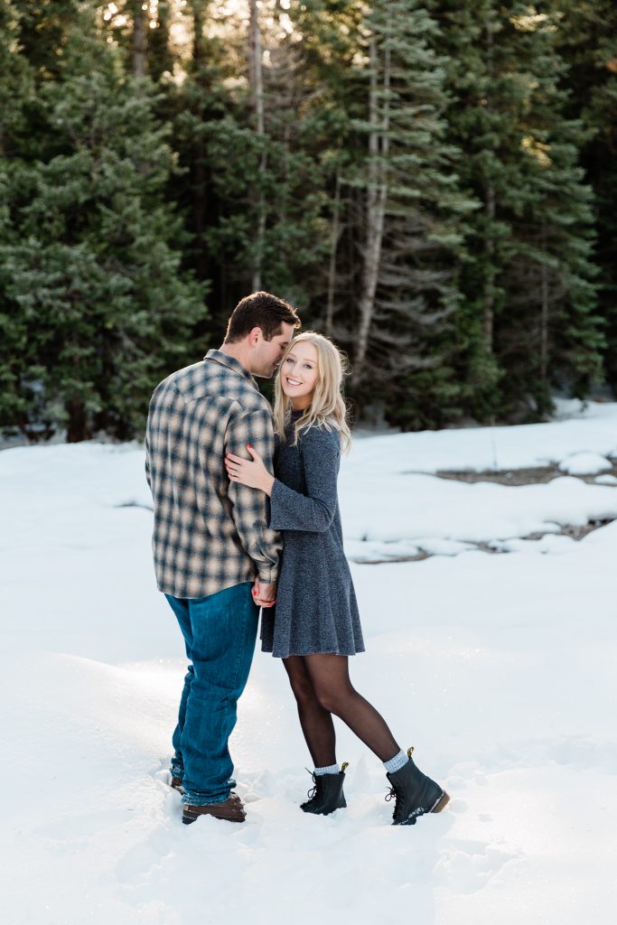 outdoor snow engagement session in dress and tights with doc martens
