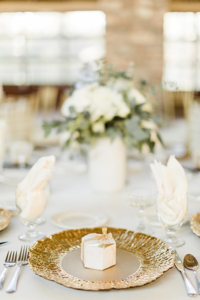 gold charger with wedding favor