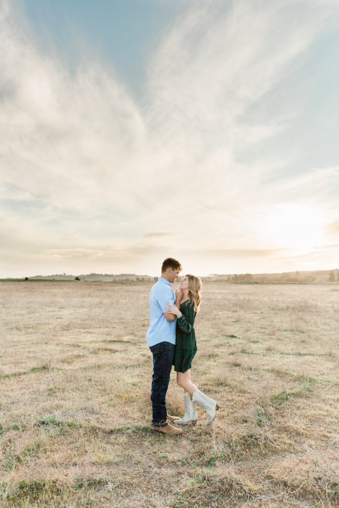 spring sunset engagement photos with a green dress
