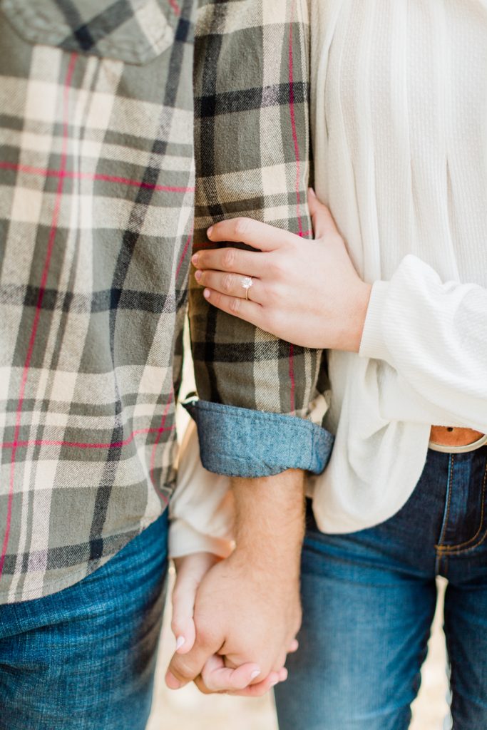 casual engagement photo outfit ideas and a solitaire engagement ring