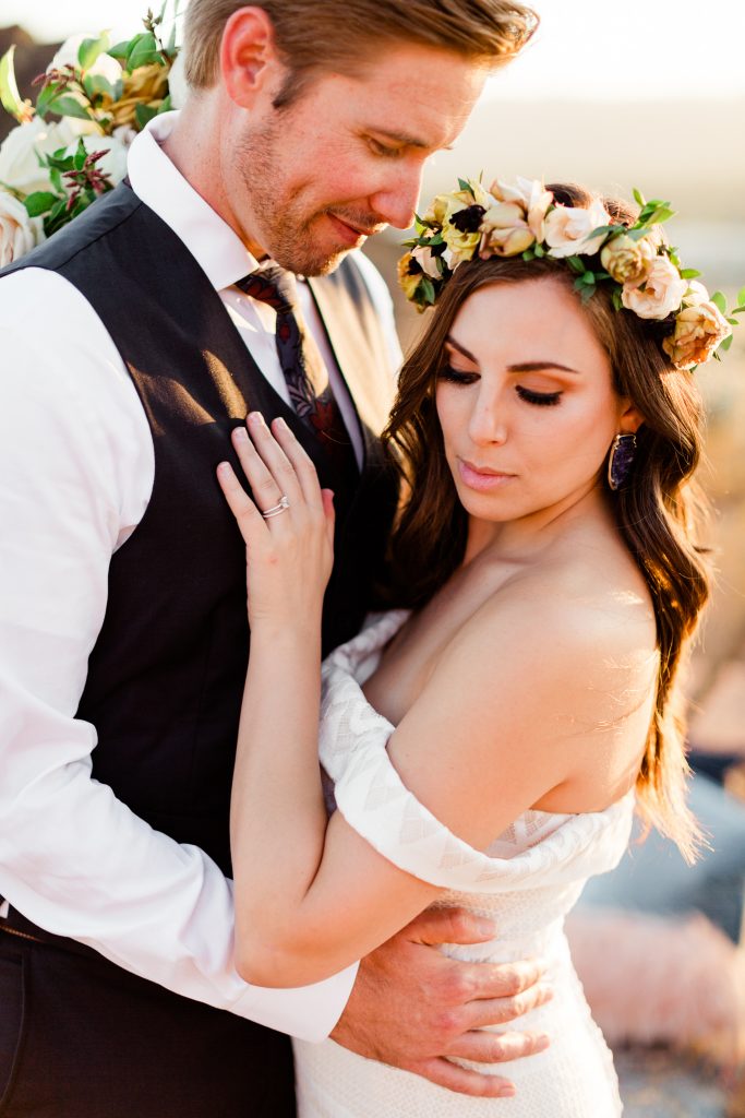 close up portrait of couple with bohemian flower crown