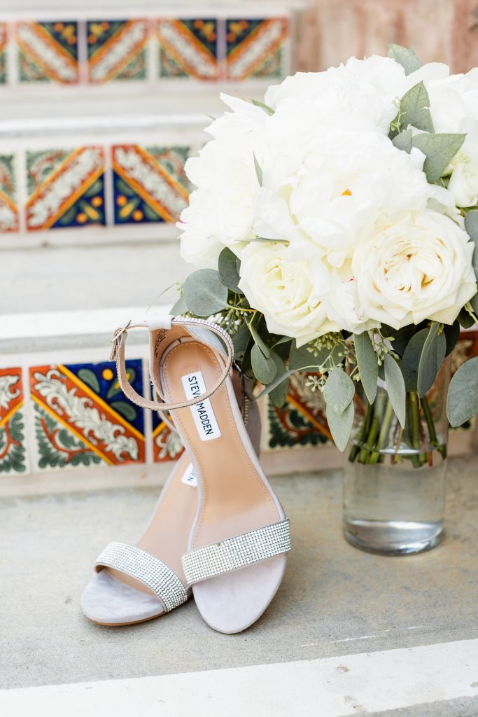steve madden heels and bridal bouquet on steps at Wolf Lakes Park