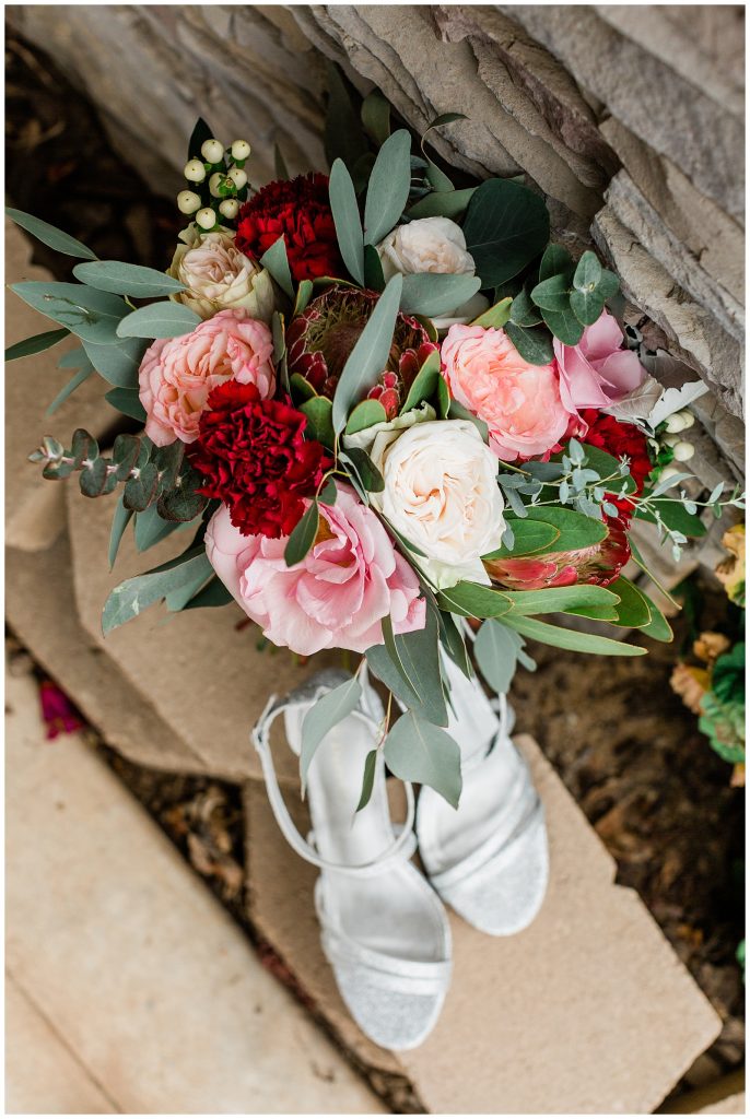 pink, red, and white bridal bouquet with eucalyptus