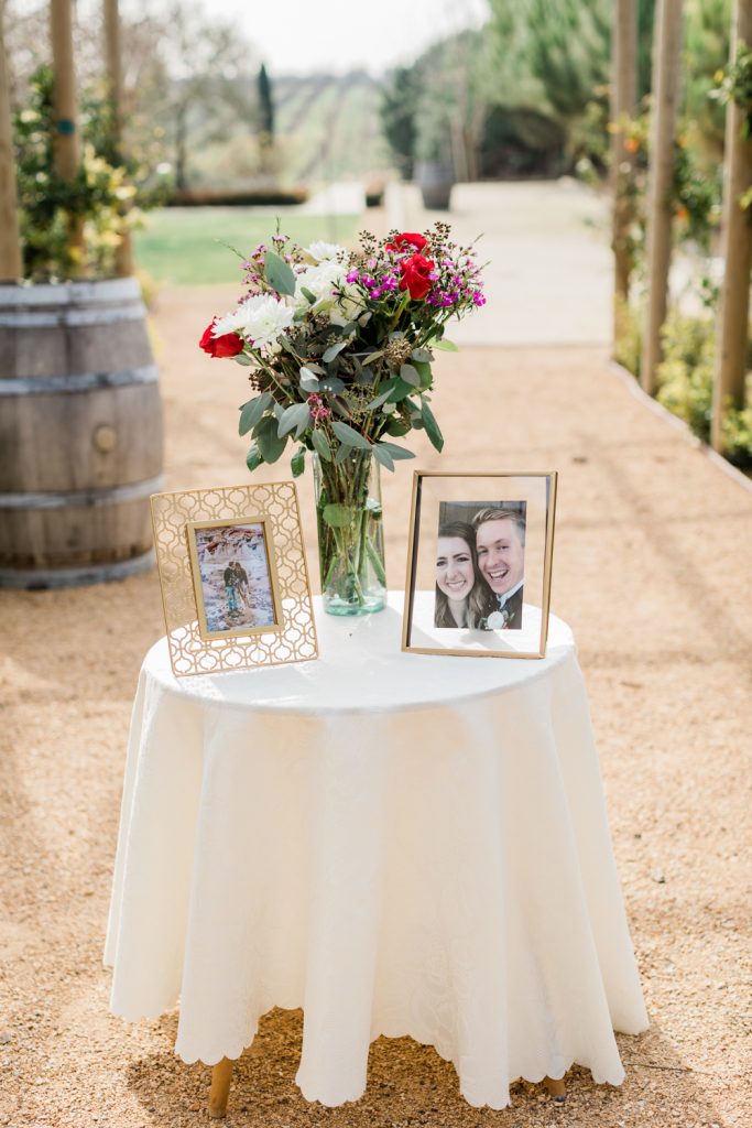 surprise proposal table set up with flowers and picture frames