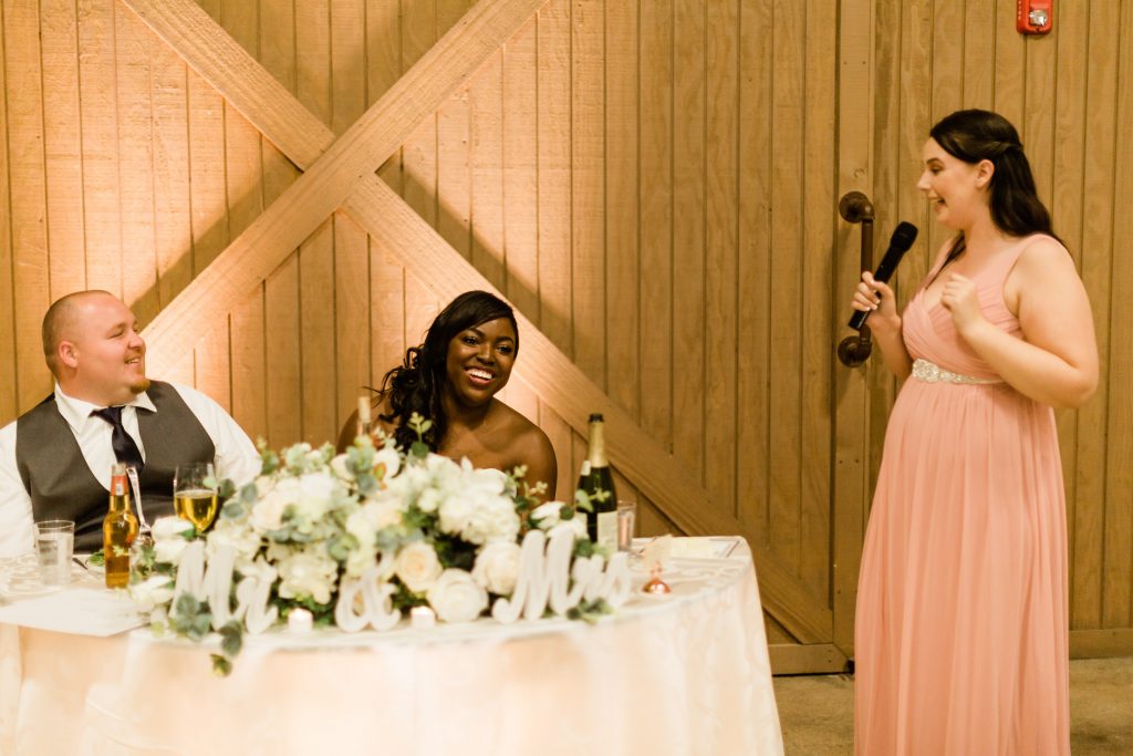 bridesmaid toast making couple laugh