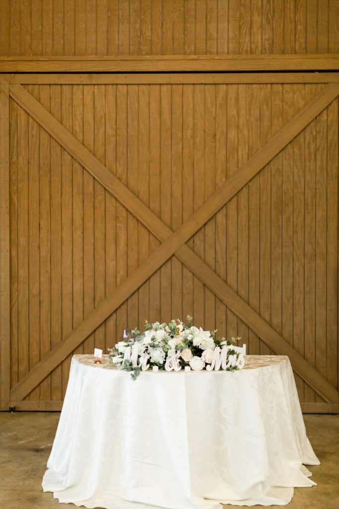wooden barn back drop for Mr. and Mrs. table at Kings River Winery