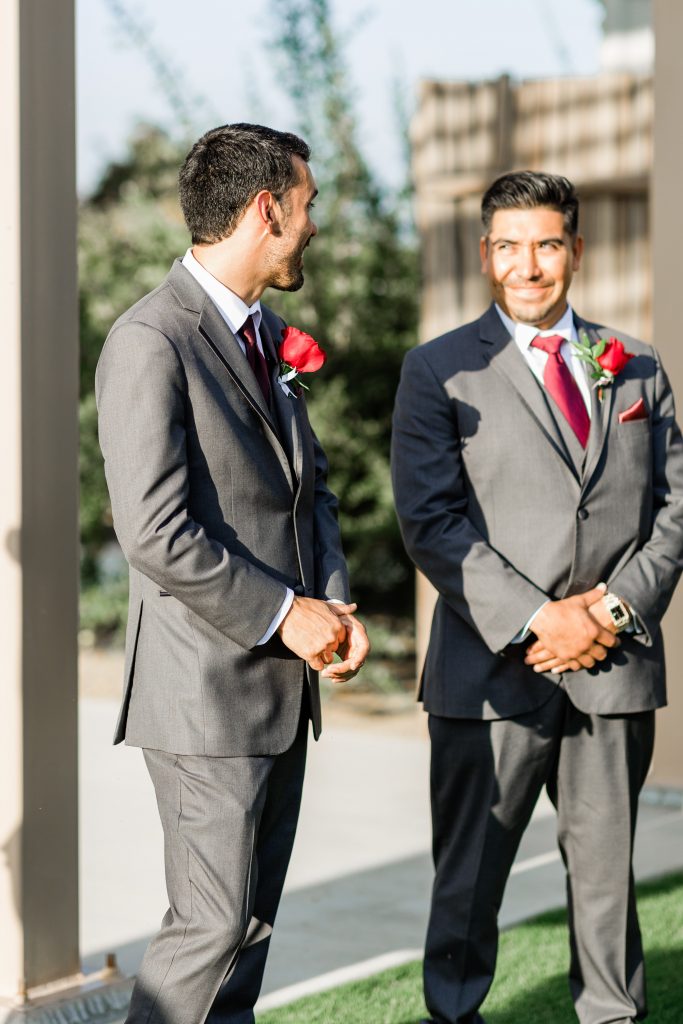 groom exchanging a look with his best man before the wedding ceremony