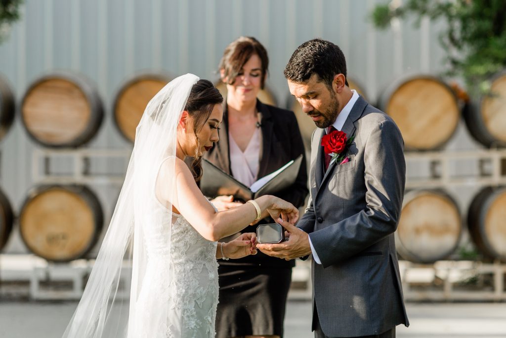 couple exchanging rings during their wedding ceremony