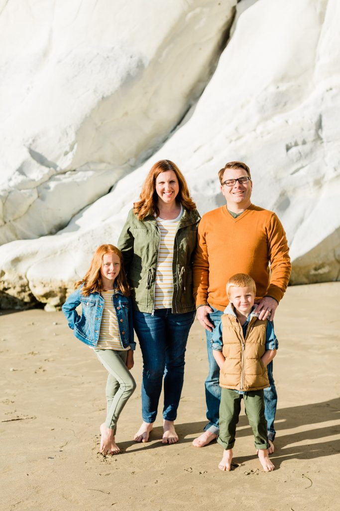 beach family photos by white cliff rocks