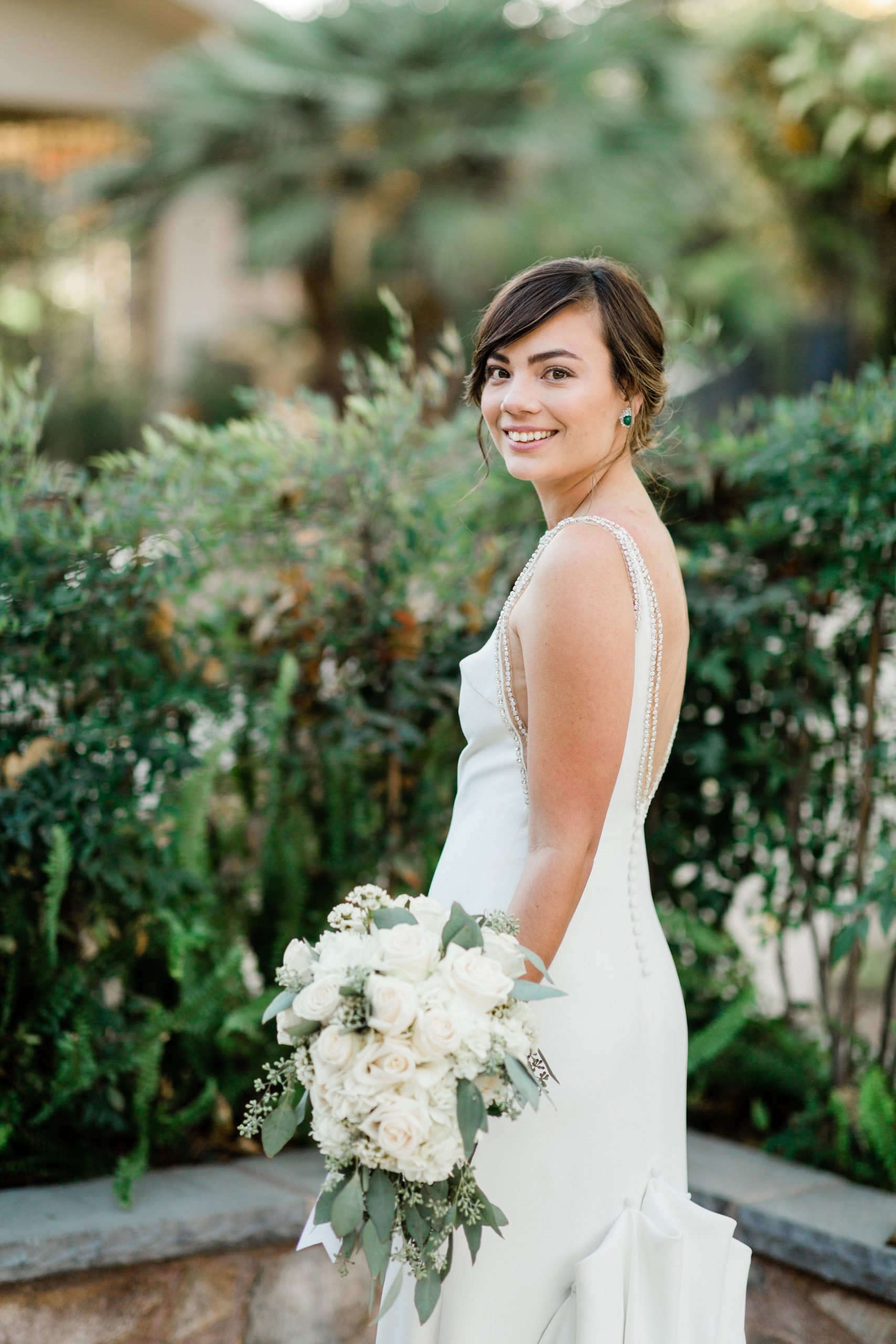 bride smiling in simple elegant wedding gown