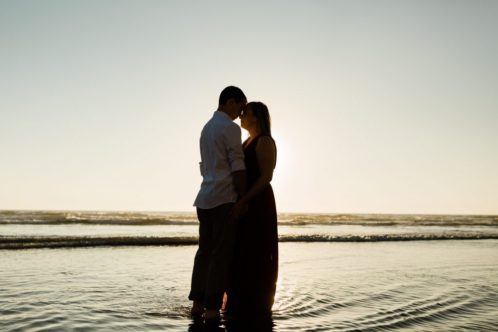 beach engagement silhouette at sunset