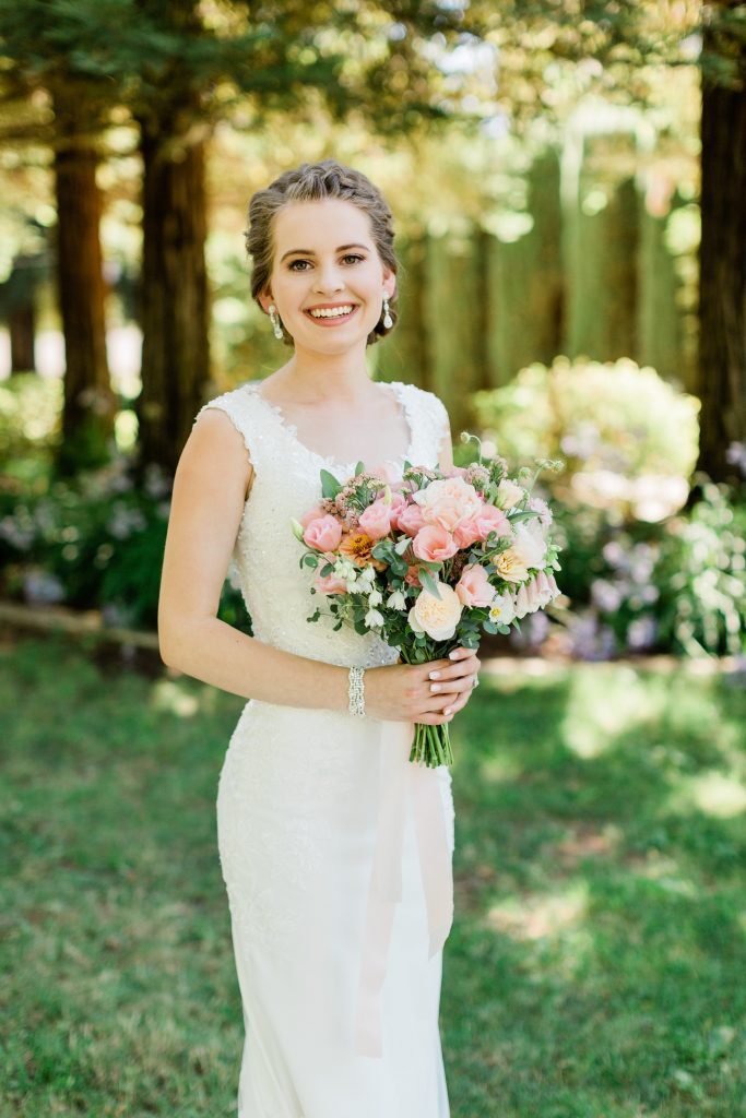Bride in beaded dress with blush bouquet 
