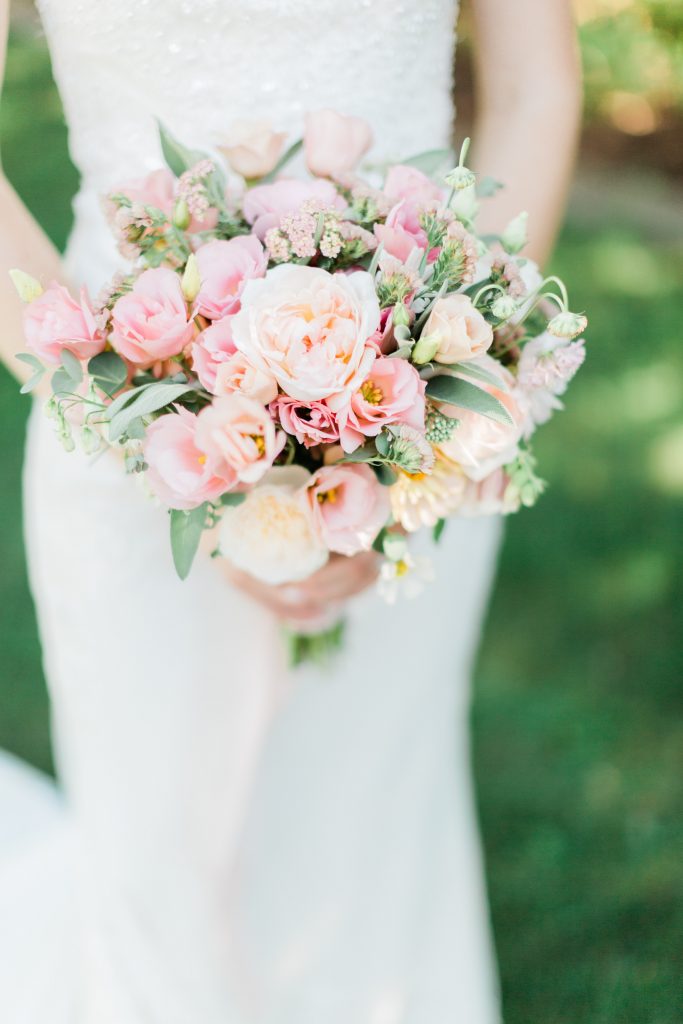 blush wedding bouquet with greenery by fresh bread and flowers a fresno wedding florist