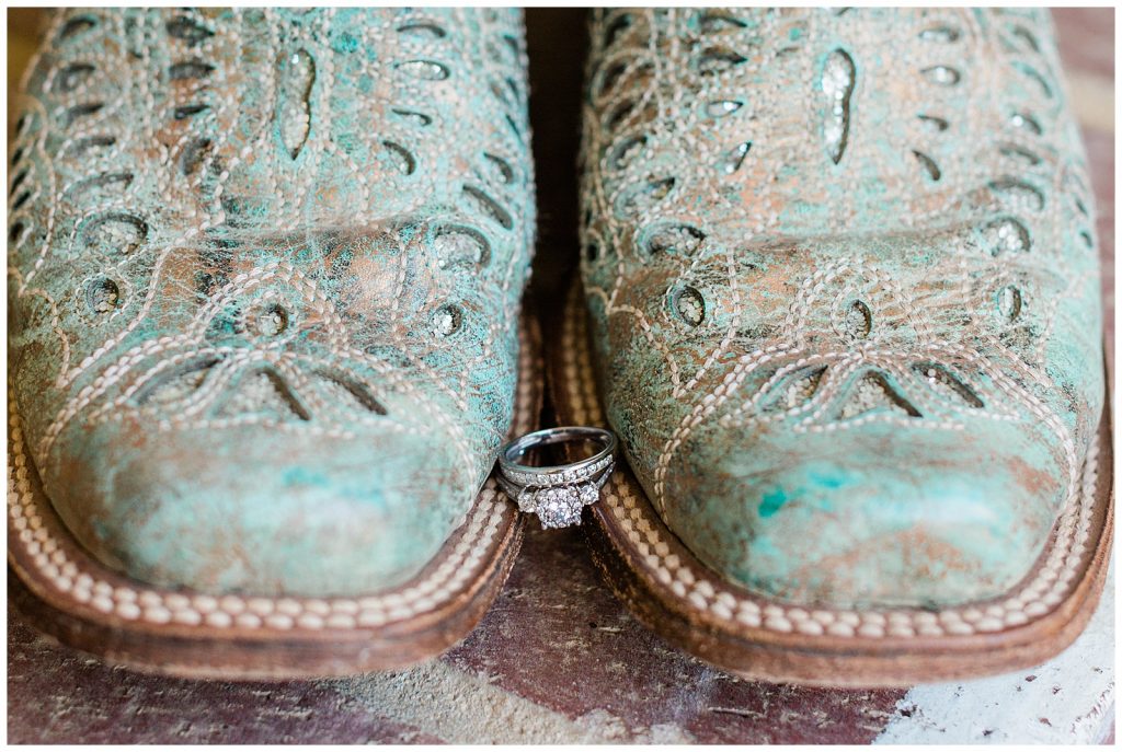 Teal boots with wedding rings. 