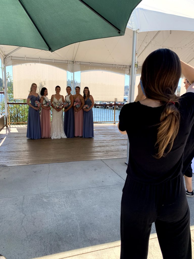 wedding photography assistant catches photographer taking bridesmaids photos
