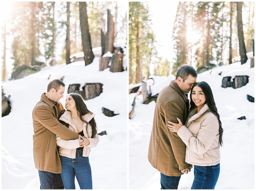 Engaged couple hugging and laughing in the snow