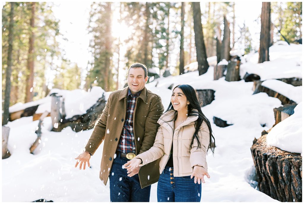 Couple throwing snow at Grant Grove
