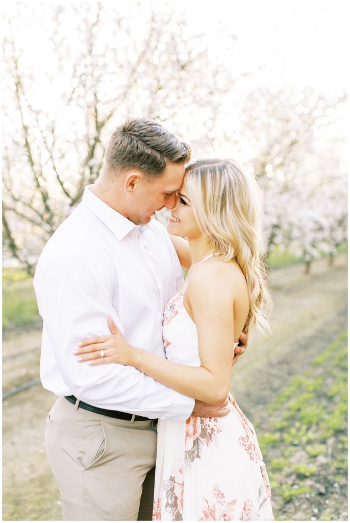 Couple naturally in love for spring engagement photos. 
