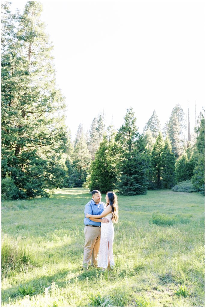 couple embracing in a meadow in shaver lake california