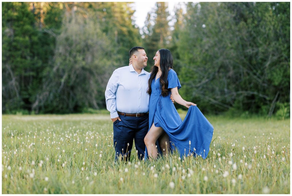 meadow engagement photos of a couple embracing and smiling