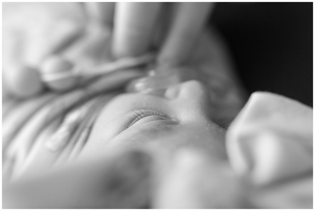 black and white image of newborn baby eyelashes